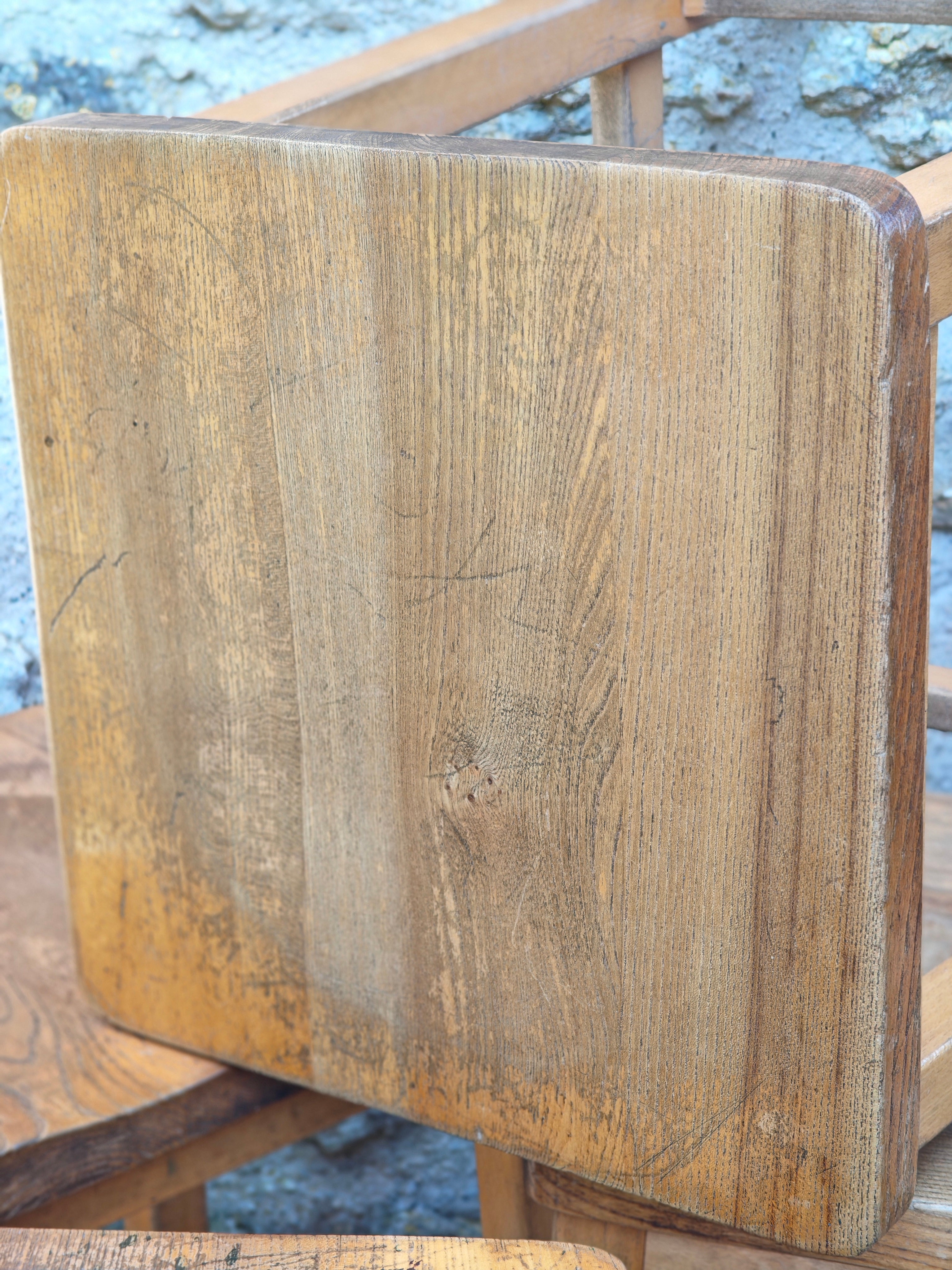 Close-up of the seat of a wooden lab stool